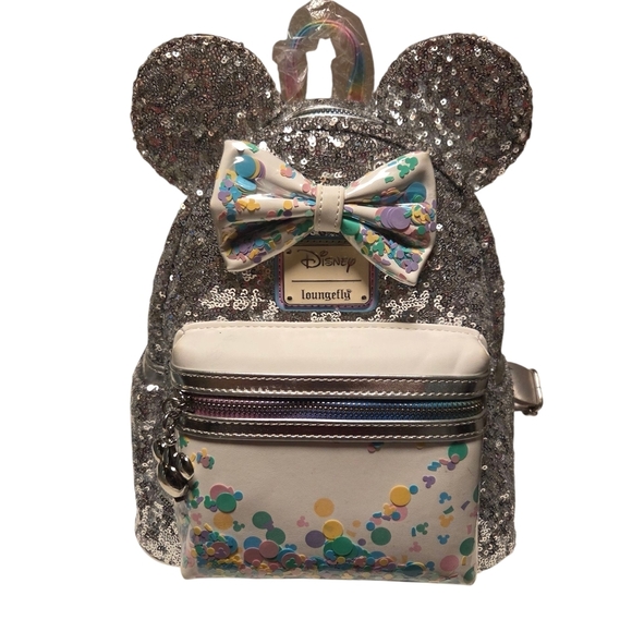 Disney loungefly Other - Loungefly Silver Sequin Backpack with Colorful Bow